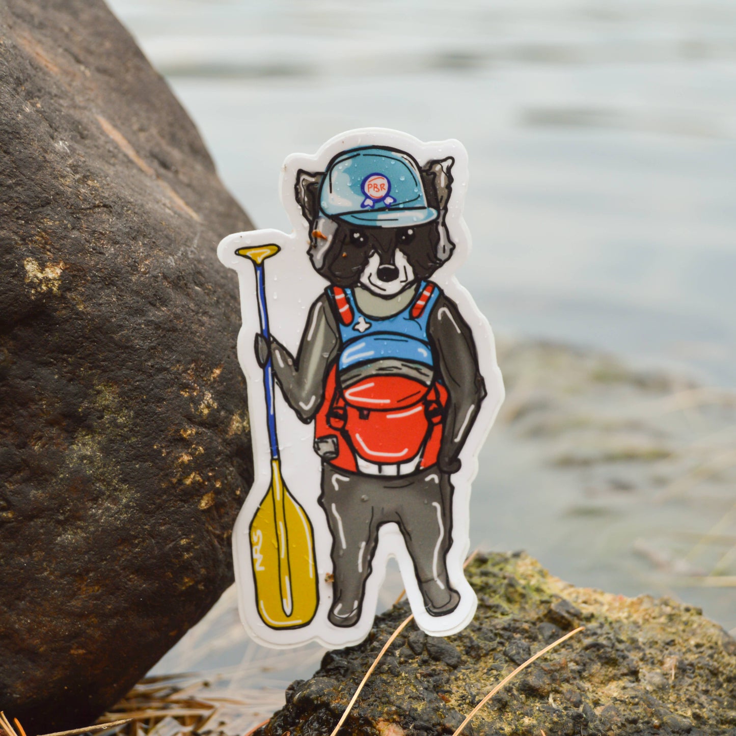 Paddleboarding Raccoon Sticker