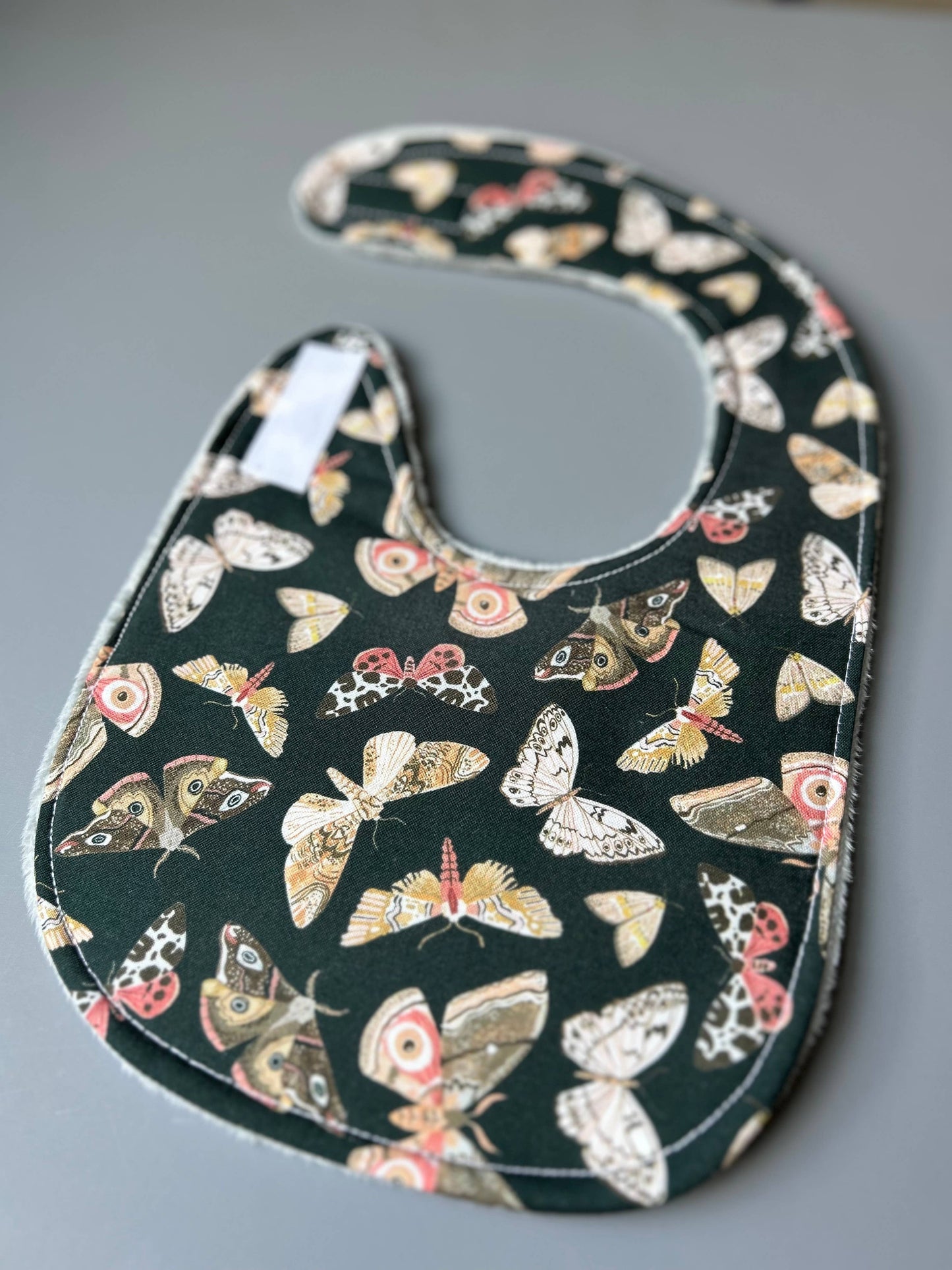 Moths and More on Dark Green bib