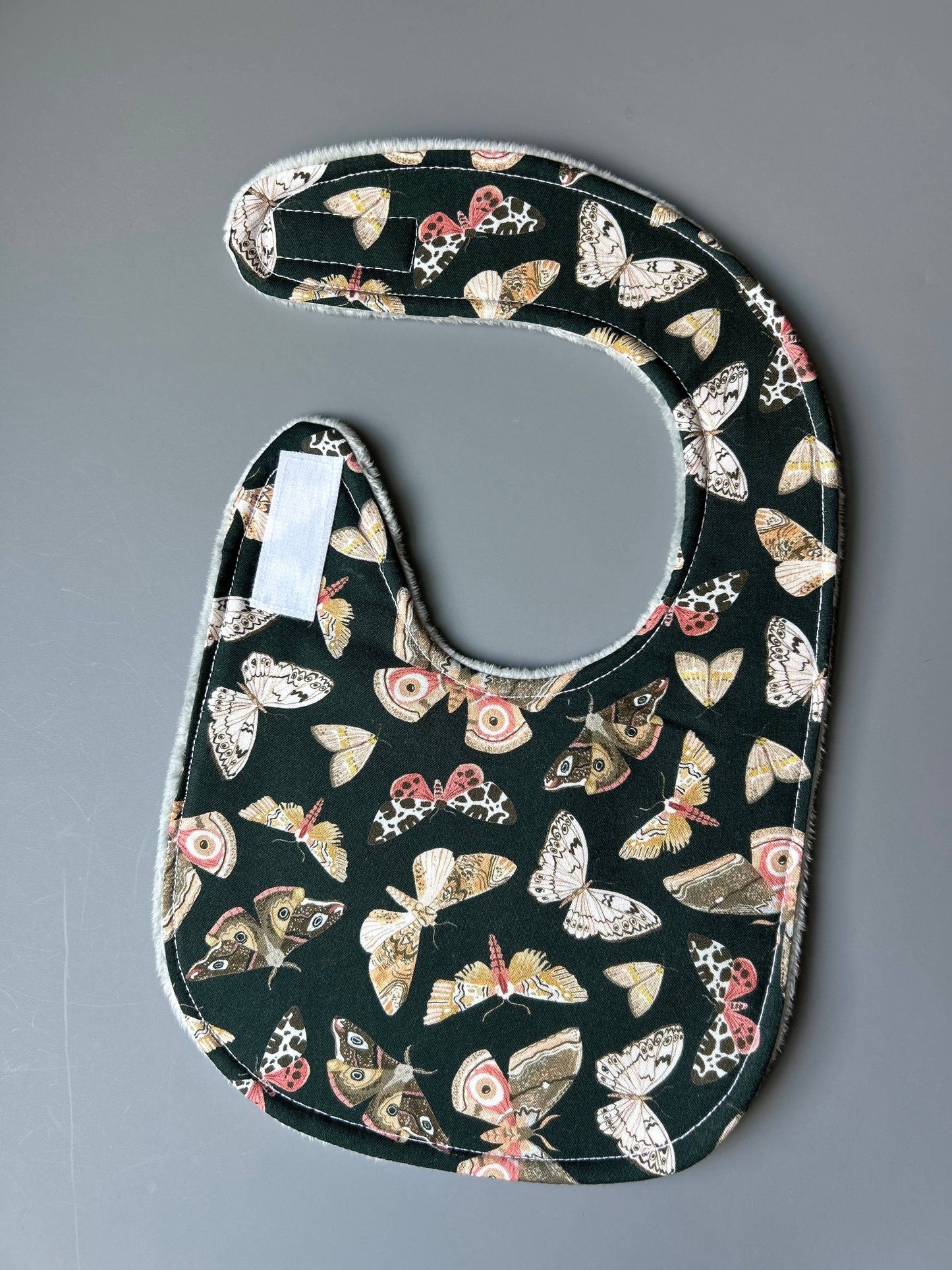 Moths and More on Dark Green bib